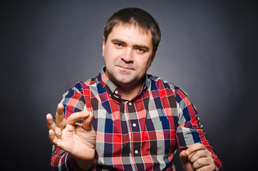 Portrait of young man of gesticulating by hands