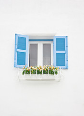 Fototapeta premium Blue open window with flowers ornament.