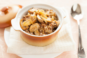 Buckwheat with mushrooms and onions in a pot