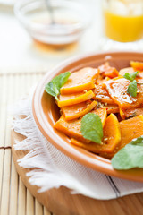 pumpkin cooked with honey and mint on a dish