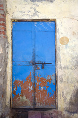 old and aged blue metal door