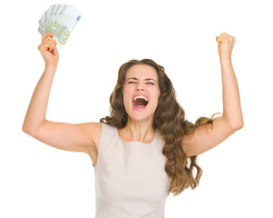 Obraz premium Happy young woman with euro banknotes rejoicing success