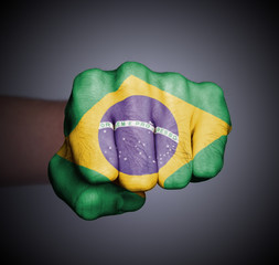 Front view of punching fist on gray background