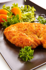Pork chop, peaches and vegetable salad