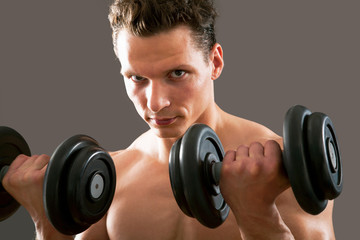 Man with weight training equipment
