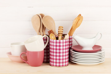 Cups, bowls nd other utensils in metal containers isolated