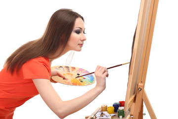 Fototapeta premium beautiful young woman painter at work, isolated on white