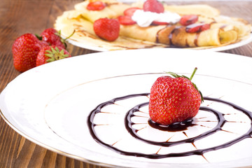 pancakes with fresh strawberries and chocolate