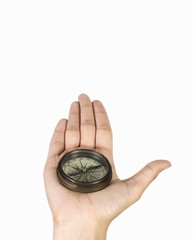 Close-up of a person's hand holding a compass