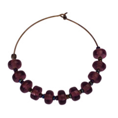 Close-up of an earring made from beads