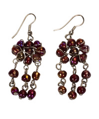 Close-up of a pair of earrings made from beads