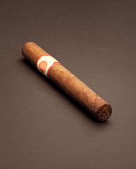 photo of cigar over brown background