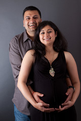 Happy East Indian Husband with his Pregnant wife