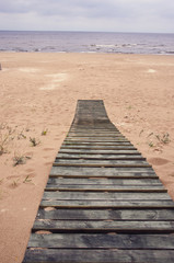 wooden track on Baltic sea beach in Jurmala