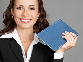 Businesswoman with notepad or organizer