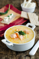 Cheese soup with vegetables and salmon