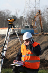 Surveyor at construction site