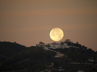 the Setting Moon at Dawn over Nerja Andalucia Spain