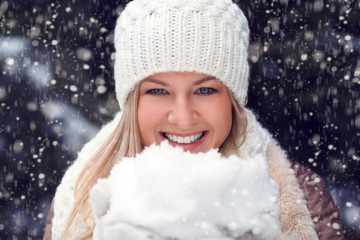 happy woman holding snow