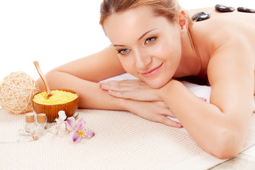 woman receiving spa stones therapy