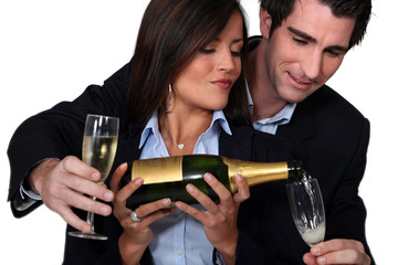 Couple celebrating with a glass of wine