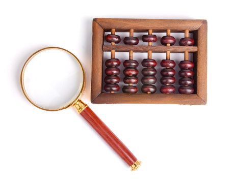 Chinese abacus and Magnifying glass,business concept