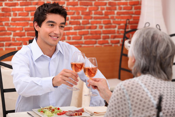 Grandmother and grandson at restaurant