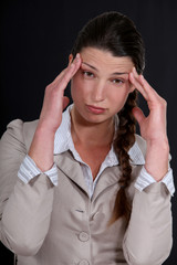 A businesswoman with a headache.