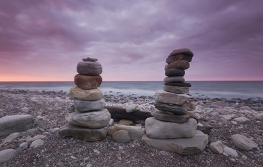 Piling of rocks, beautiful ocean in the background