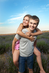 Young couple playing around in the lavender fields