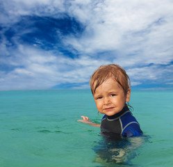 cute kid in wetsuit