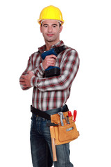 Handyman posing with cordless drill