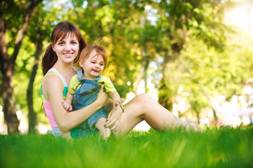 Fototapeta premium funny baby with mom in park