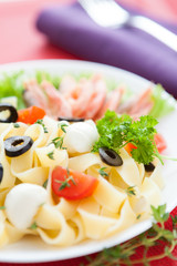 appetizing pasta with seafood and olives