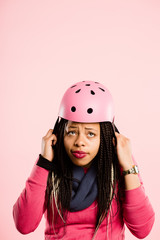 funny woman wearing Cycling Helmet portrait pink background real