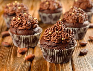 Chocolate cupcakes on a brown table