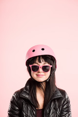 funny woman wearing Cycling Helmet portrait pink background real