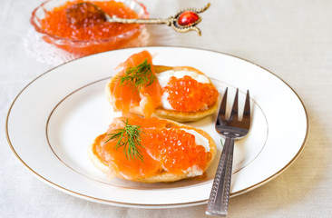 pancakes with red caviar, salmon and cheese