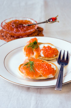 pancakes with red caviar, salmon and cheese