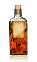 Old fashioned drug bottle with label, isolated.