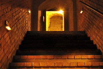 Old stone tunnel. Underground route under Lublin, Poland. - obrazy, fototapety, plakaty