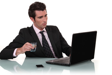 Office worker drinking glass of water