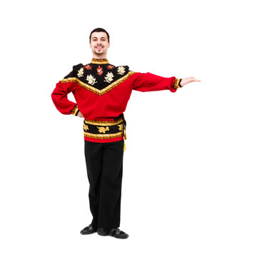 young man wearing a folk russian costume posing