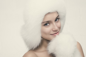 Fashion portrait of young beautiful woman posing on white backgr