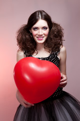 Fashion shot of woman in doll style with balloon