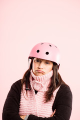funny woman wearing Cycling Helmet portrait pink background real