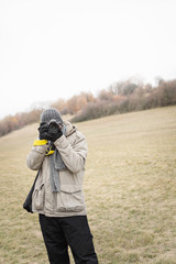 Young male photographer in nature