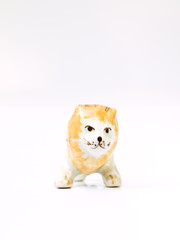 A ceramic lion doll isolated on white background   in front view