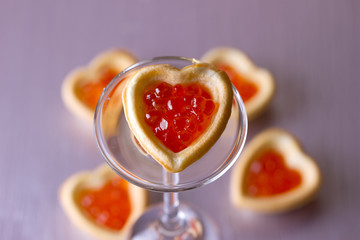 Tartlets with heart-shaped eggs