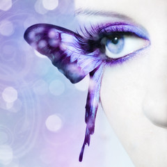 beautiful woman eye close up with butterfly wings